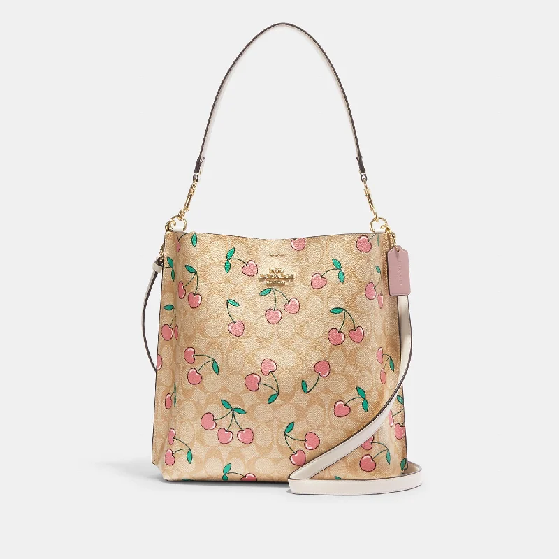 Coach Outlet Mollie Bucket Bag In Signature Canvas With Heart Cherry Print