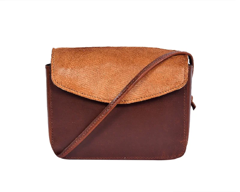 Elevate Your Style with our Brown Leather Sling Bag with Hair-On Detailing. Art: BG-1450